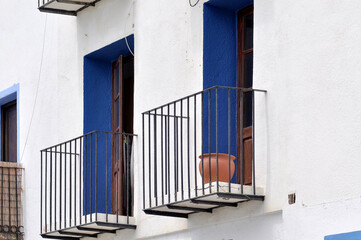 white facade with blue windows