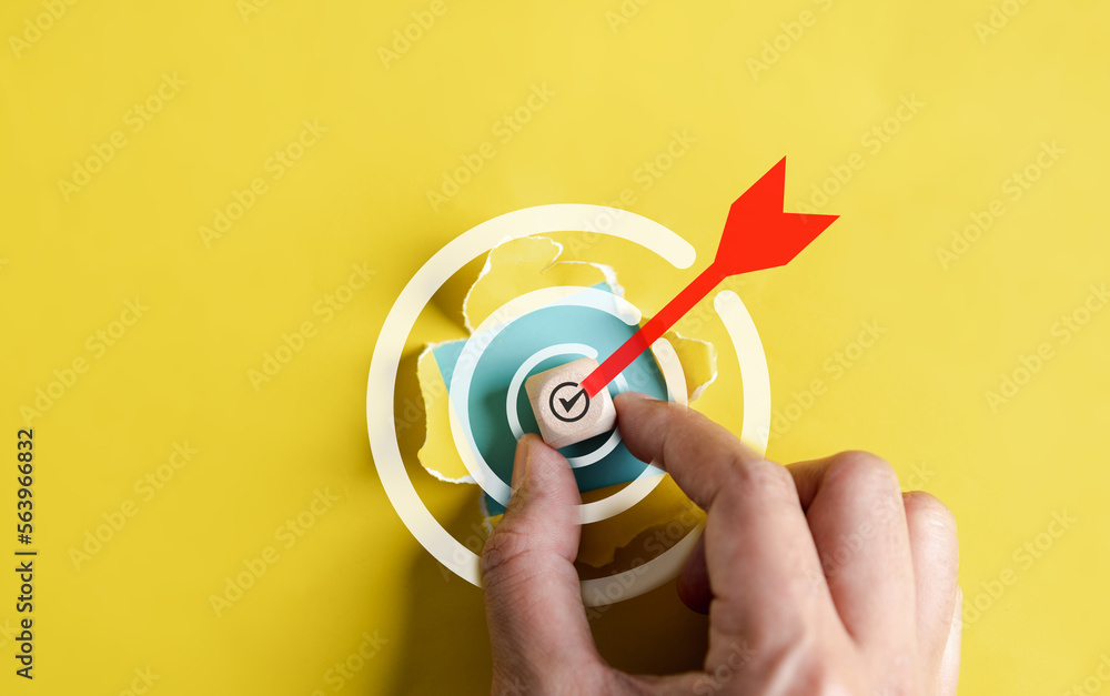 Aufkleber dartboard with arrow hiding of yellow punched paper, businessman target for planning business object