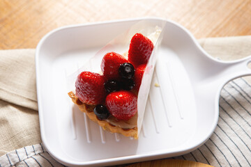 Strawberry and blueberry slice whipped cream cake	