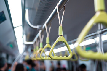 Hanging straps in Subway , empty background of metro train