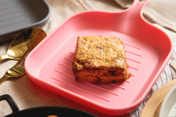 Scones and assorted bread on a plate	