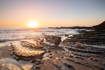 Obraz premium Sunlight and Sea at Amoreira Beach; Algarve; Portugal