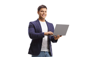 Man holding an open laptop computer and smiling at camera