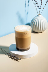 Lavender latte drink. Sunlight and hard shadows