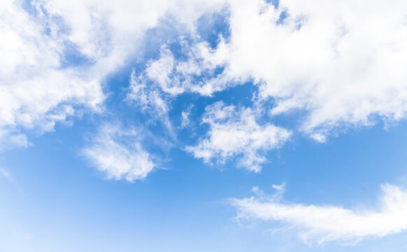 Blue sky with white clouds on a sunny day. Natural background
