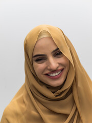 Portrait of young muslim woman wearing hijab on isolated white background