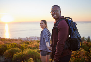 Portrait, wellness and hiking interracial couple exercise in sunset on a mountain as a morning...