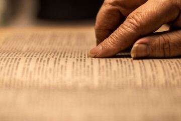Woman reading ancient book - Bible.