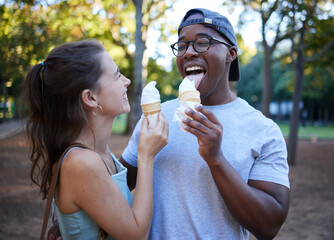 Interracial, ice cream or couple of friends in a park walking on a fun romantic date in nature...