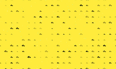 Seamless background pattern of evenly spaced black road roller symbols of different sizes and opacity. Vector illustration on yellow background with stars