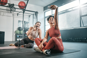 Fitness, phone or friends take a selfie at gym for social media after workout exercises in health club. Relaxed girls, photo or happy sports women take pictures after exercising or training together