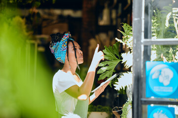 Green business, woman and checklist for stock, inventory and plant, shop and garden supplies. Black...