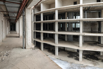 High-rise frame reinforced concrete building with a free layout. Atrium.