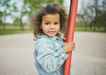 Portrait, black girl and in park to play, summer and happiness on weekend, freedom and carefree. Outdoor, African American kid and female young person at playground, motivation and child development