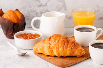 Hot coffee, croissants on a light background, selective focus.