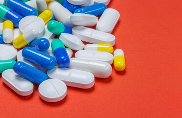 Medical pills . On red background. Top view . Medicine concept