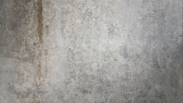 stained cement texture, rusty rough gray textured grunge concrete wall background with blank space for design. old weathered wall. © WONGSAKORN