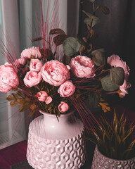 Delicate peonies in a vase in a home interior
