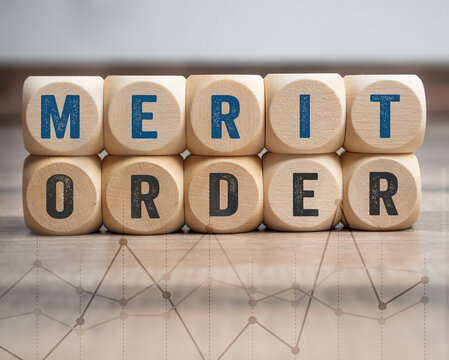 Cubes, dice, blocks with merit-order effect with a curve on wooden background