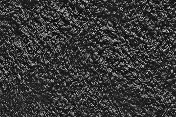 Fototapeta premium Dark background of gray coarse fabric texture