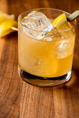 Whiskey sour. Classic Cocktail. Mixed drink with whiskey, lemon juice, sugar, and optionally, a dash of egg white. It is a type of sour, a mixed drink with base spirit, citrus juice, and a sweetener. 