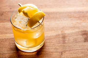 Whiskey sour. Classic Cocktail. Mixed drink with whiskey, lemon juice, sugar, and optionally, a dash of egg white. It is a type of sour, a mixed drink with base spirit, citrus juice, and a sweetener. 