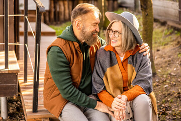 Man and woman sitting close and looking in love