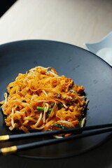 Fried Thai Noodle with Pad Thai and Vegetable, Put on Wooden Table