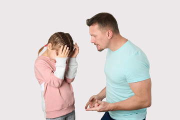 Father beating and punishing his daughter - obrazy, fototapety, plakaty