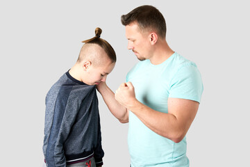Father beating and punishing his son - obrazy, fototapety, plakaty
