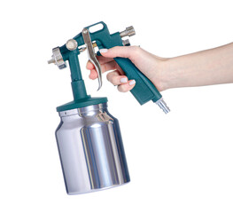 Paint spray gun in hand on white background isolation