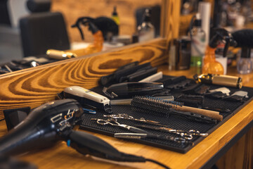 Close up of barbers tools on the wooden surface