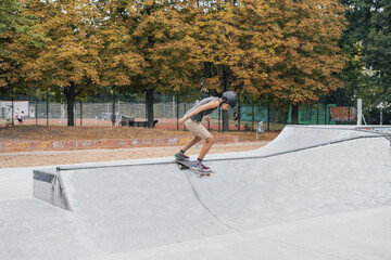 Hispanic girl doing skateboard tricks at a skate park in Berlin © Amparo Garcia