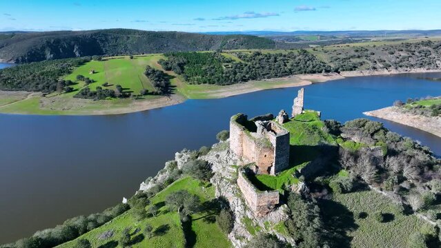 Aerial view from a drone of the Templar Castle of Alba de Aliste and the Ricobayo reservoir in the surroundings of the town of Castillo de Alba. Zamora. Castile and Leon. Spain. Europe