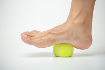 Tennis ball roll massage for plantar fascia stretch. Foot muscle exercises.