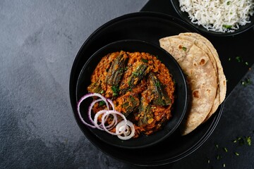Homemade Punjabi Bhindi Masala | Okra cooked in spiced onion tomato gravy served with rice and roti