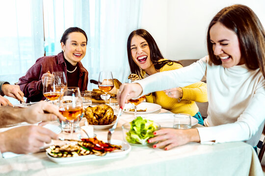 Group of girl friends smiling at table dinner - Girls having fun together at Lunch - Friendship life style concept with young people having fun together at restaurant