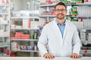 Pharmacy, portrait and pharmacist man smile for medicine, product on shelf and healthcare industry help desk. Trust, expert and medical professional worker for supplements, pills or drugs management - obrazy, fototapety, plakaty