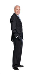 Portrait of a senior business man smiling and happy while standing isolated against a studio white background. Caucasian, mature and executive corporate CEO or professional employee