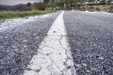 Asphalt lines with snow