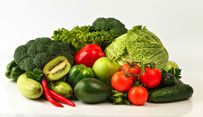 Group of red & green vegetables and fruits isolated on white. Fresh vegetables and fruits