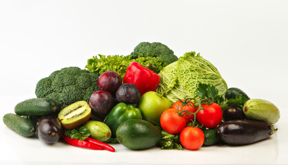 Group of red & green vegetables and fruits isolated on white. Fresh vegetables and fruits