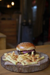 Burger and fries on a wooden table