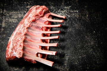 Fresh raw rack of lamb on the table. 