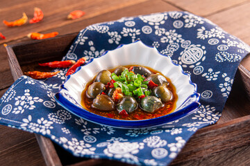 Spicy chilli Hunan style preserved egg with sauce served dish isolated on wooden table top view of Hong Kong food