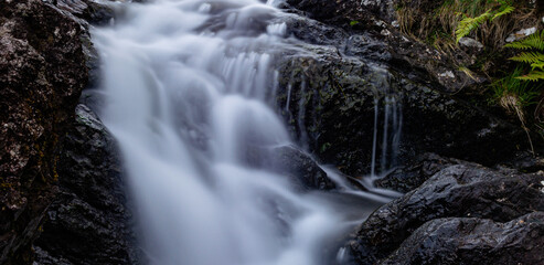 Fototapeta na wymiar A small waterfall on the way to Cadair Idris National Park Snowdonia in Wales 2022