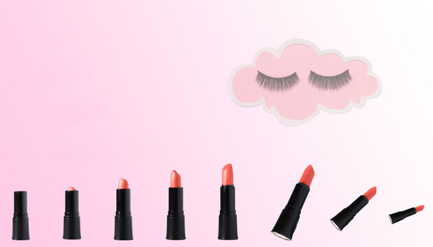 lipsticks at the bottom of the background isand cloud with lady eyelashes, creative design photo cosmetic salon
