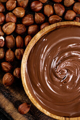 Hazelnut butter in a plate on a cutting board. 