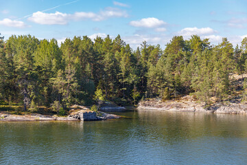 Stockholm Archipelago, view from the cruise ship. Rocks with trees.