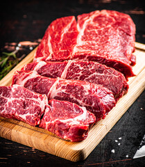 Beef raw cut on a cutting board. 